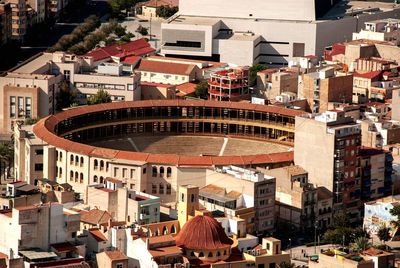 High angle view of houses of alicante surrounding a bullring arena