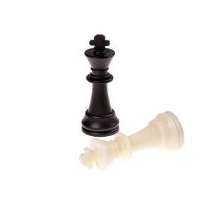 Close-up of chess pieces against white background