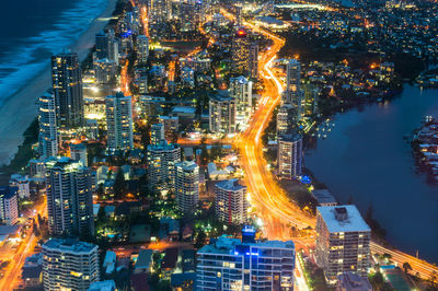 Aerial view of city lit up at night