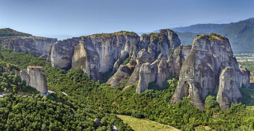 Panoramic view of trees with mountain range in background