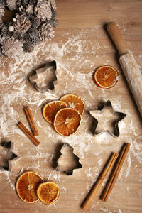 Christmas baking flat lay with flour and kitchen utensils