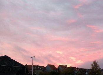 Low angle view of cloudy sky at sunset