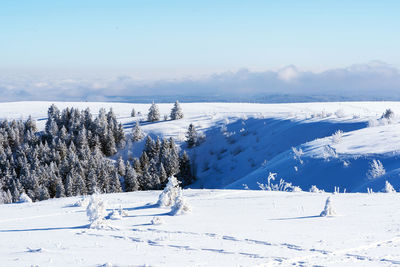 Scenic view of snow covered mountains against sky