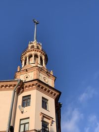 Low angle view of clock tower against sky