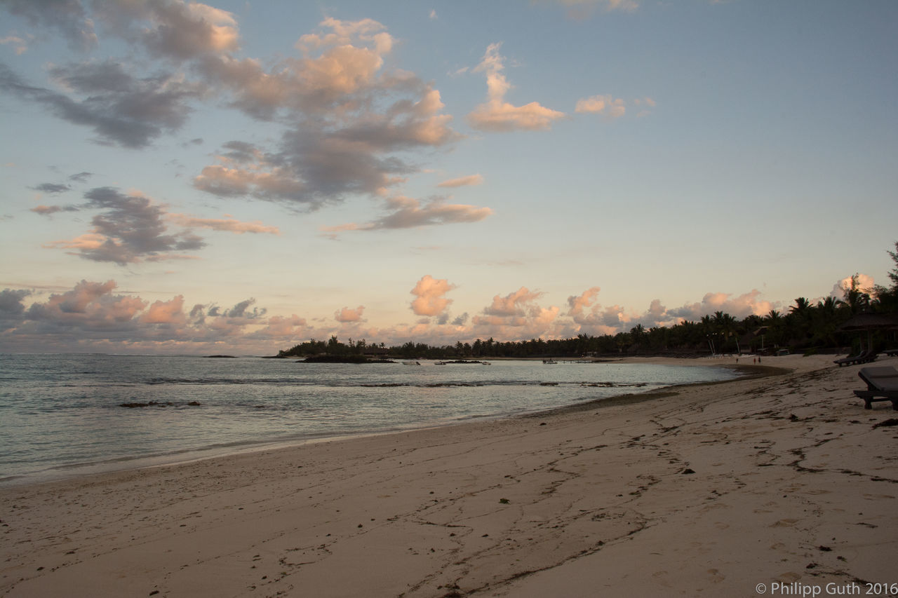 SCENIC VIEW OF BEACH DURING SUNSET