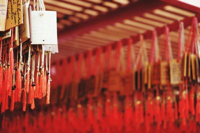 Close-up of red bell hanging in temple