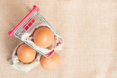 High angle view of eggs against white background