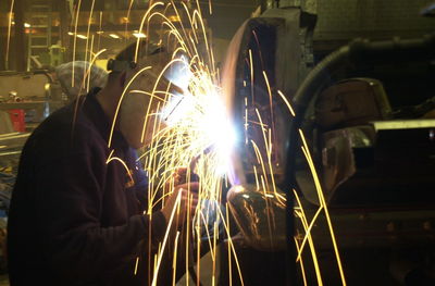 Illuminated ferris wheel at night