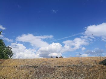 Scenic view of landscape against blue sky