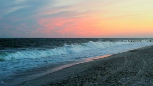 Scenic view of sea at sunset