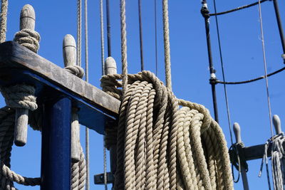 Low angle view of ropes against sky