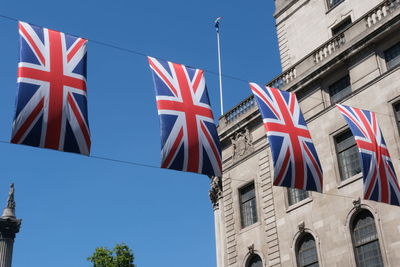British flags hanging on the streets of london. union jack flag triangular outside decoration
