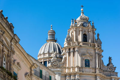 Low angle view of church against blue sky