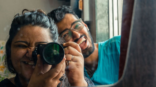 Portrait of woman photographing