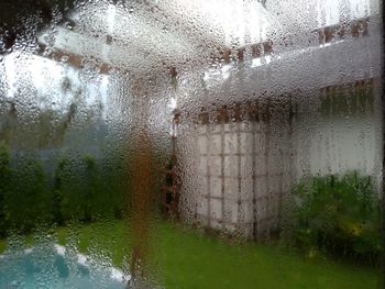 Wet glass window of building