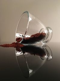 Close-up of coffee powder spilling from container on table