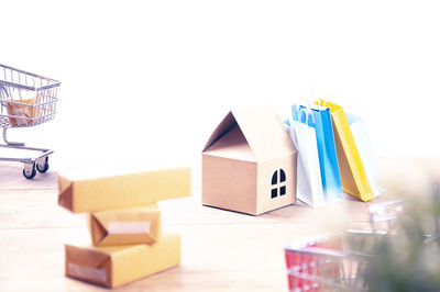 Close-up of toys on table against building