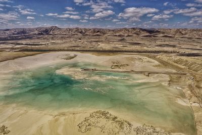 Aerial view of arid landscape against sky