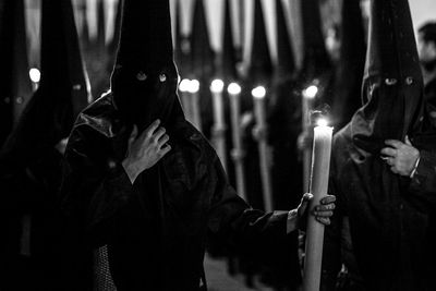 Ku klux klan people with lit candles