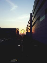 View of city street at sunset