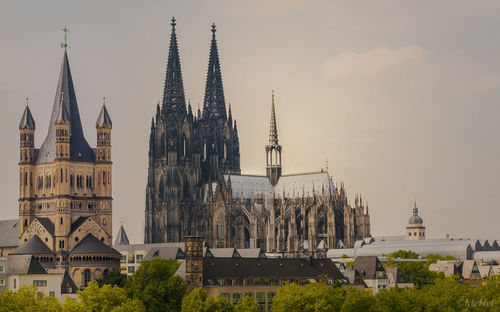 Panoramic view of buildings in city against sky