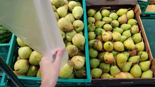 Take a plastic bag to buy grocery at the supermarket