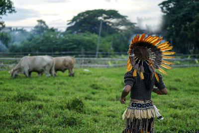 Full length of woman standing on field