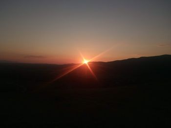 Scenic view of silhouette landscape against sky during sunset