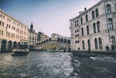 View of buildings against cloudy sky