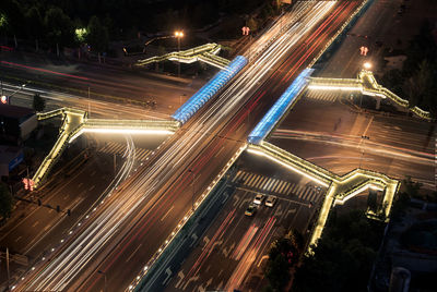 High angle view of light trails on city street