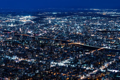 High angle view of illuminated cityscape at night