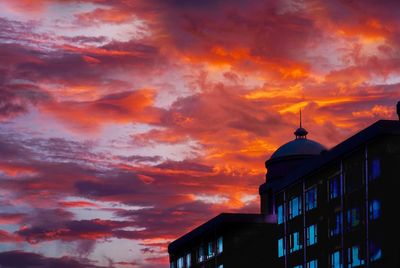 Low angle view of building against sky during sunset