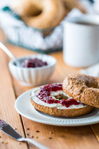 A multigrain bagel and cream cheese.