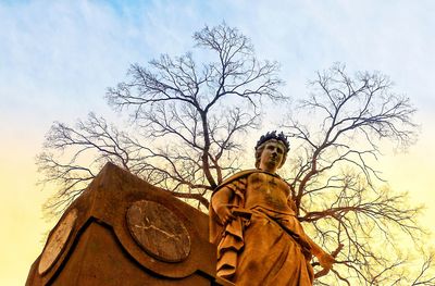 Low angle view of statue against sky