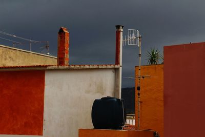 Low angle view of smoke stack against sky