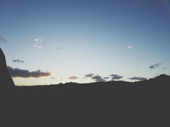 Silhouette landscape against sky during sunset