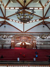 High angle view of people praying in mosque