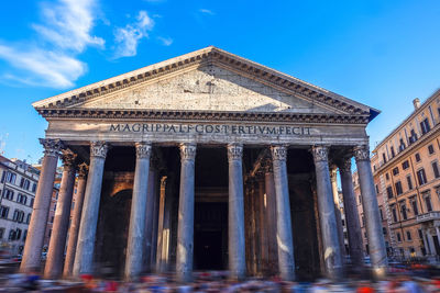 Low angle view of historical building against blue sky