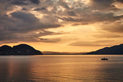 Scenic view of sea against dramatic sky