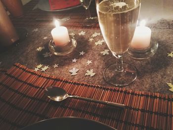 High angle view of tea light candle on table