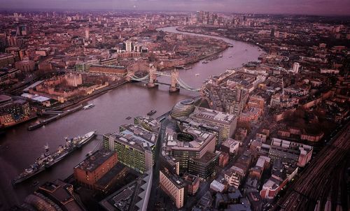 High angle view of river and cityscape against sky