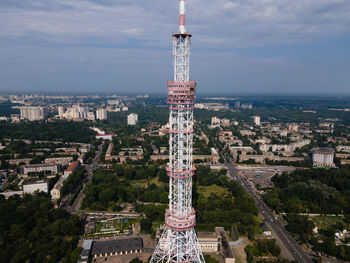 Aerial view of buildings in city against sky