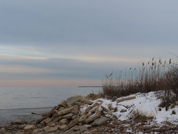 Scenic view of sea against sky during winter