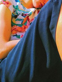 Low section of woman on bed