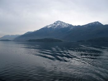 Scenic view of sea against cloudy sky