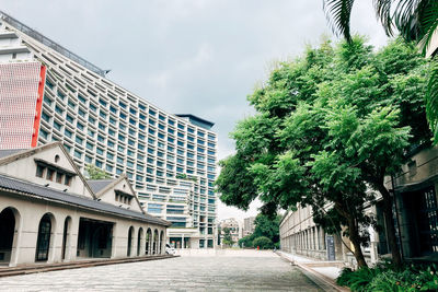 Street amidst buildings against sky