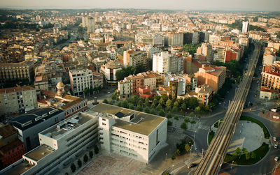 High angle view of buildings in city against sky