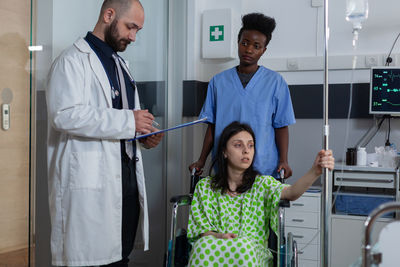 Portrait of female doctor standing in hospital