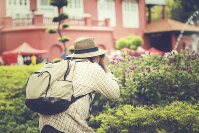 Rear view of woman standing outdoors