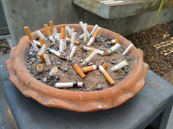 High angle view of cigarette butts in ashtray